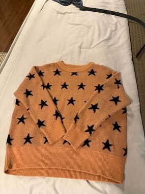 She + Sky Orange Crewneck Sweater with Black Star Pattern